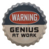 Barevná kulatá cedule  WARNING GENIUS AT WORK s úmyslným odřením - 13*2 cm